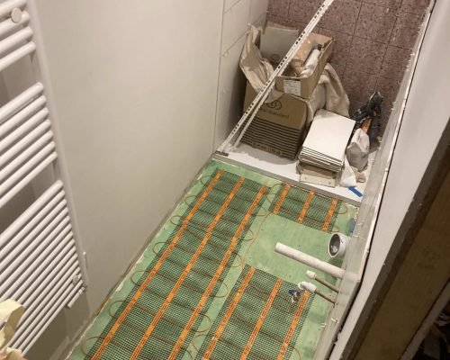Electric underfloor heating mat laid in a bathroom